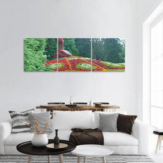 Floral Peacock Garden Sculpture Panoramic Canvas Wall Art - 3 Piece / 25" x 08"