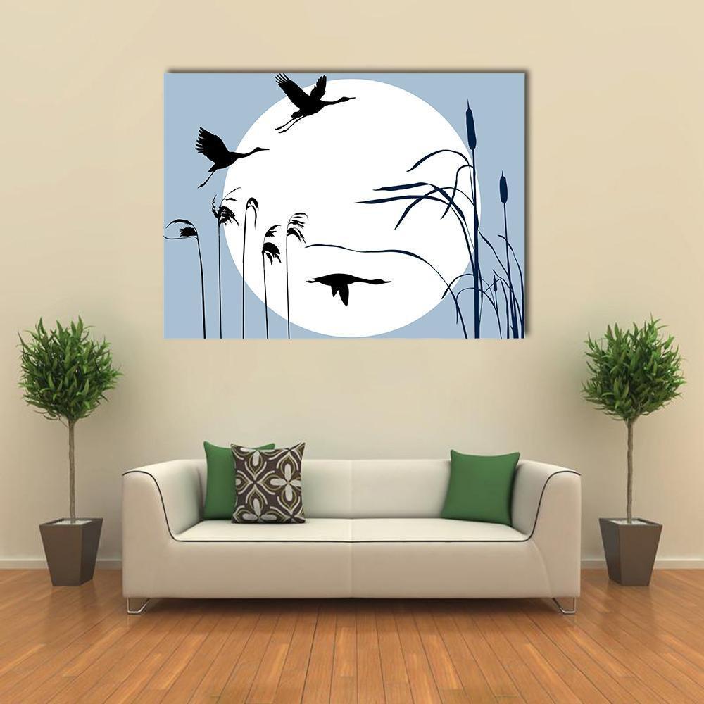 Three Flying Birds Silhouette with Moon Canvas Wall Art in black, white and blue, single panel hung on a wall