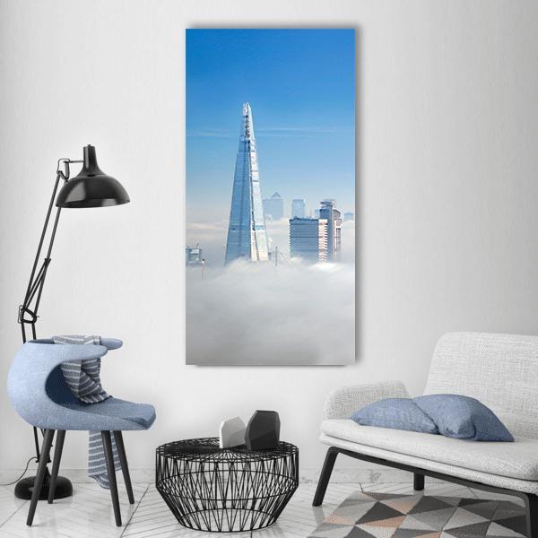 London Fog Over the Shard Vertical Canvas Wall Art in white, gray and blue, single vertical panel hung on a wall