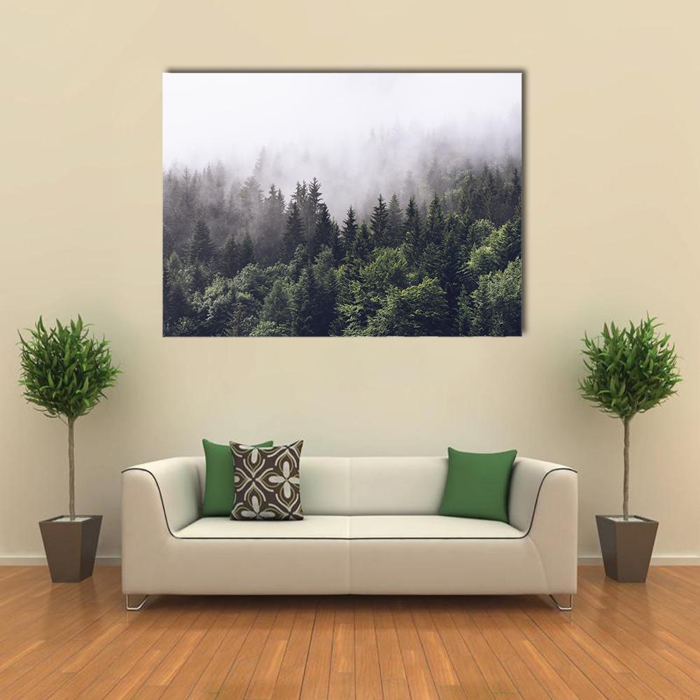 Misty Forest and Mountain Scene Canvas Wall Art in white, gray and green, single panel hung on a wall
