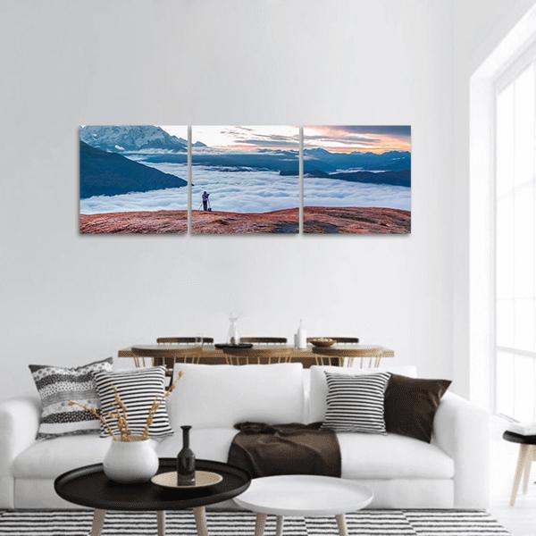 Foggy Caucasus Mountains at Dawn Panoramic Canvas Wall Art in white, brown and blue, hung on a wall