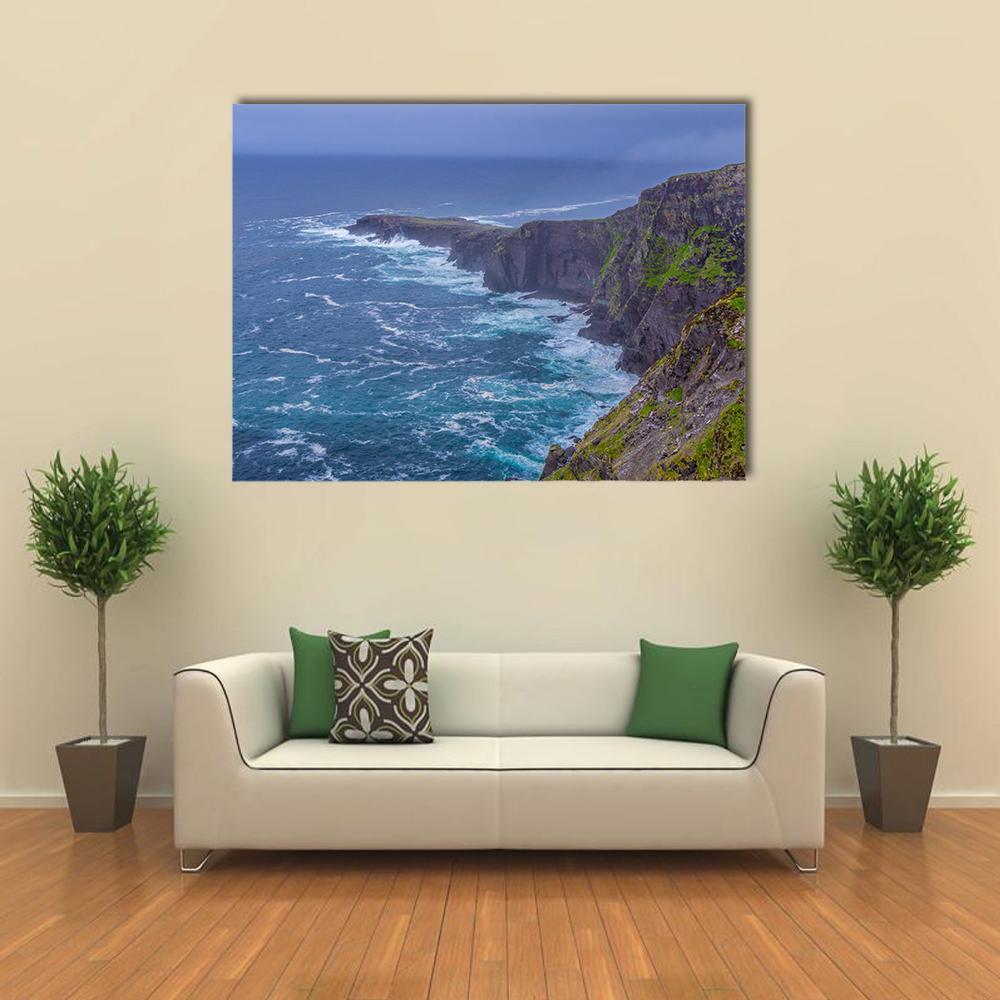 Fogher Cliffs with Foaming Waves Canvas Wall Art in gray, green and blue, single panel hung on a wall