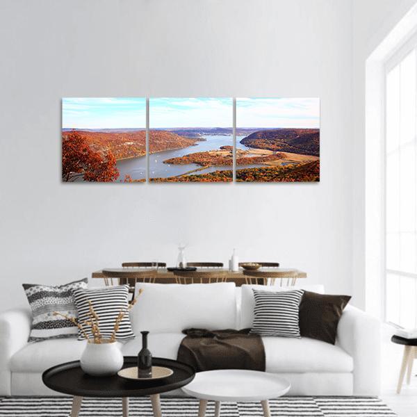Hudson River in Autumn Panoramic Canvas Wall Art in brown, orange and blue, hung on a wall