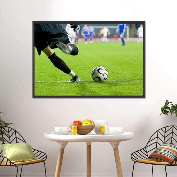 Horizontal image of soccer ball being kicked by footballer against