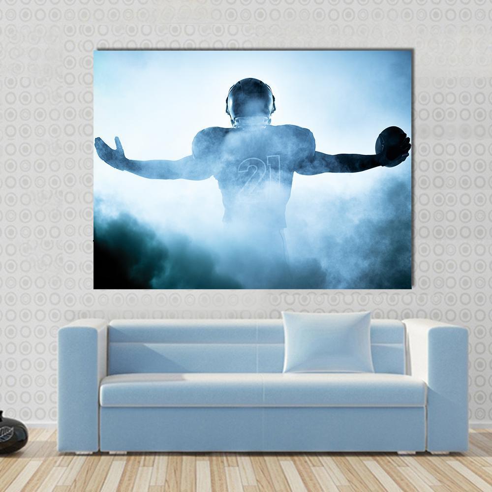 Football Player Portrait Silhouette Canvas Wall Art in black, white and blue, 5 panel Star layout hung on a wall