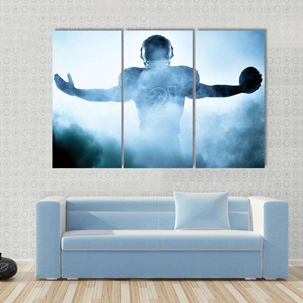 Football Player Portrait Silhouette Canvas Wall Art in black, white and blue, 5 panel Star layout hung on a wall