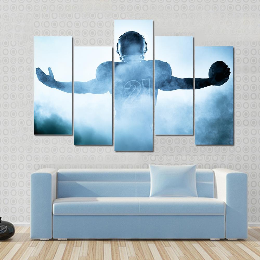 Football Player Portrait Silhouette Canvas Wall Art in black, white and blue, 5 panel Star layout hung on a wall