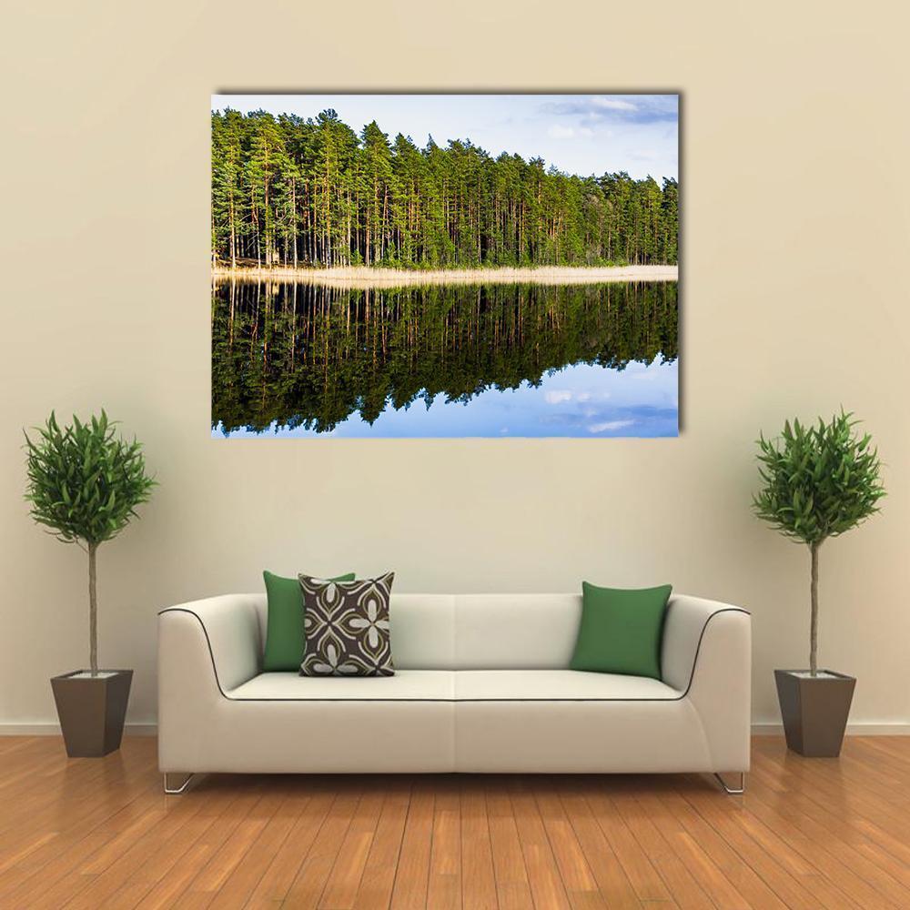 Lakeside Footbridge with Forest Reflection Canvas Wall Art in brown, green and blue, single panel hung on a wall
