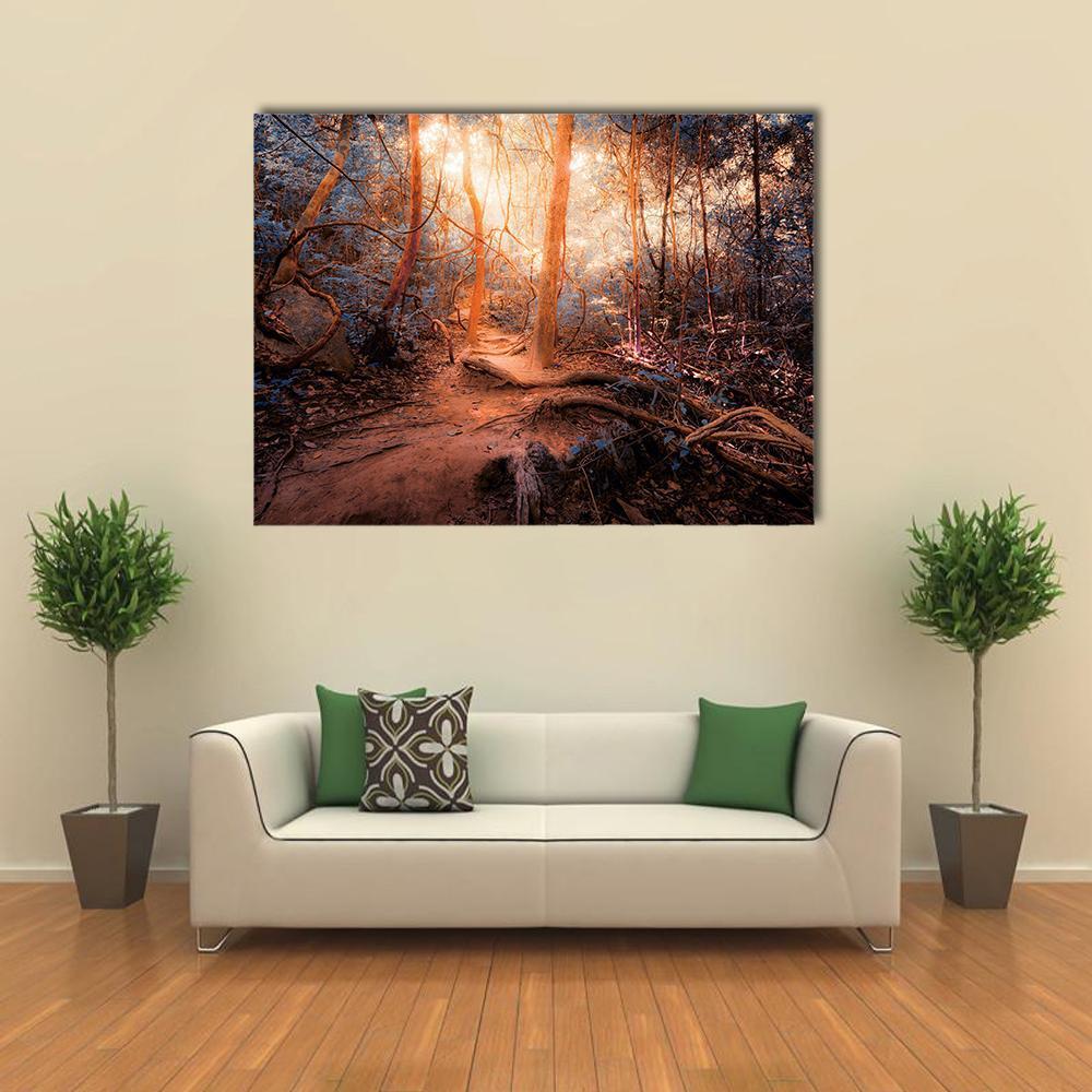 Surreal Forest Path with Glowing Sunlight Canvas Wall Art in brown, orange and blue, single panel hung on a wall