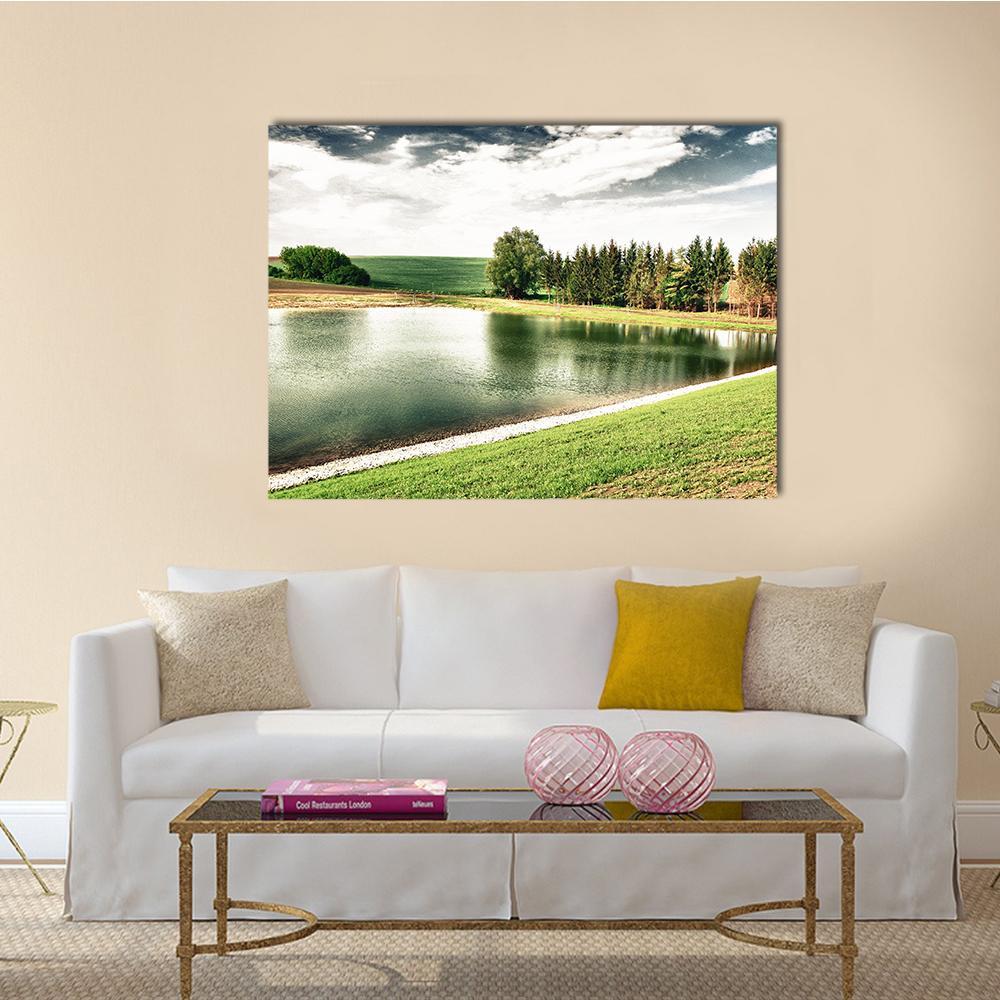 Forest Lake with Reflections Canvas Wall Art in white, green and blue, single panel hung on a wall