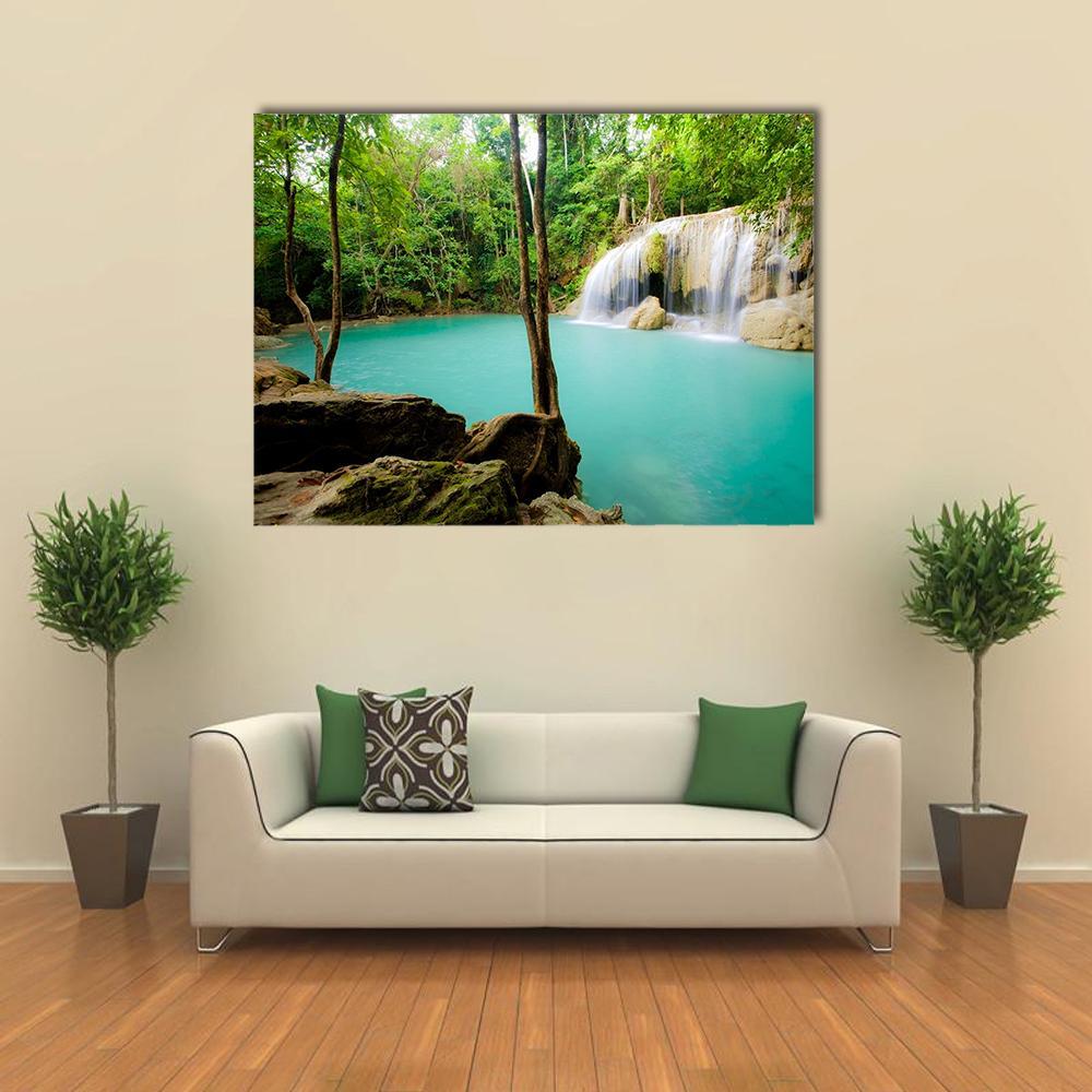 Tropical Forest Waterfall Canvas Wall Art in brown, green and blue, single panel hung on a wall
