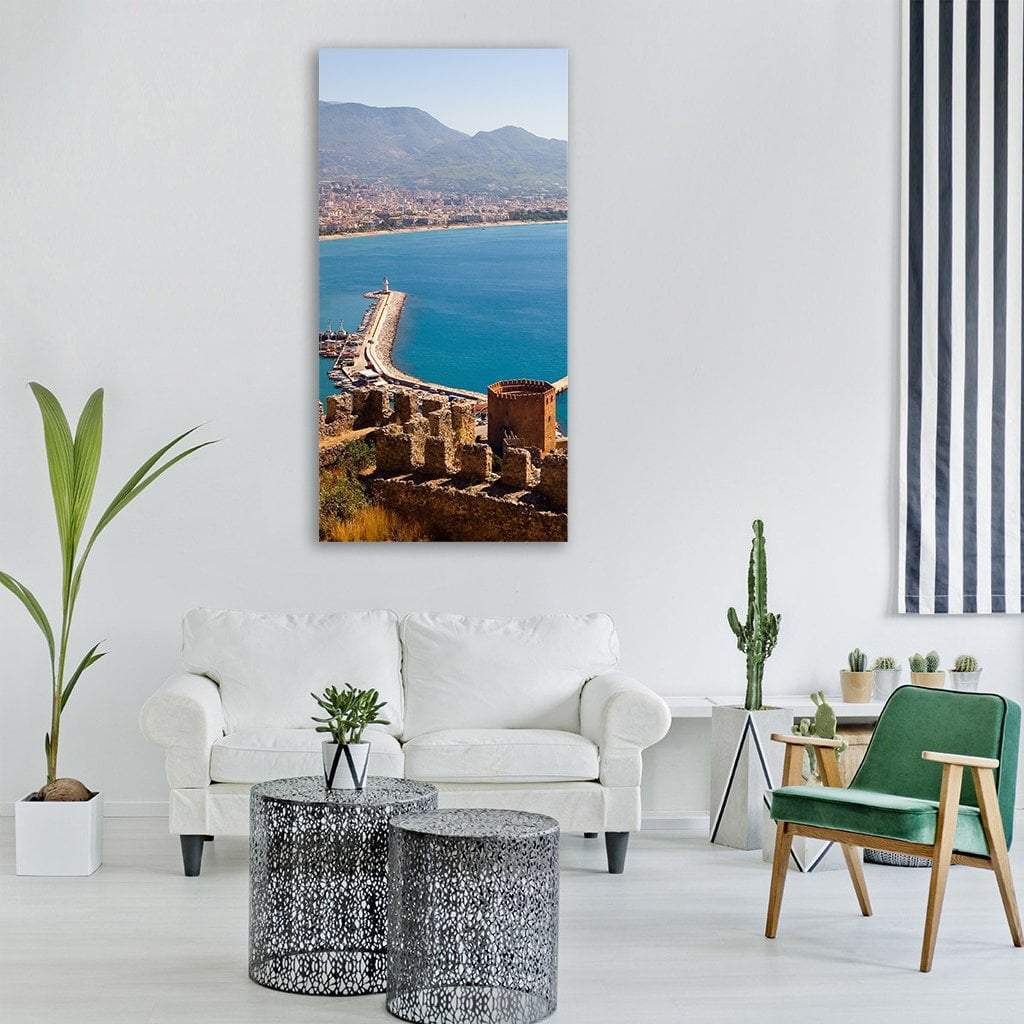 Red Tower Above Turquoise Harbor Vertical Canvas Wall Art in brown, red and blue, single vertical panel hung on a wall