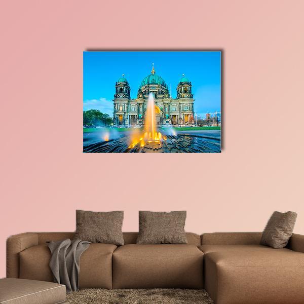 Berlin Cathedral and Fountain at Dusk Canvas Wall Art in orange, green and blue, single panel hung on a wall
