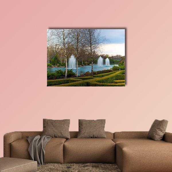 Garden Park with Three White Fountains Canvas Wall Art in white, green and blue, single panel hung on a wall