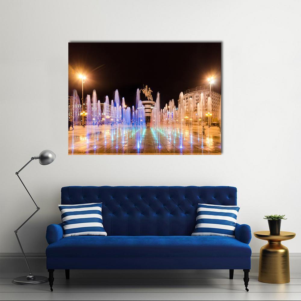 Dancing Fountains in Macedonia at Night Canvas Wall Art in black, yellow and blue, single panel hung on a wall
