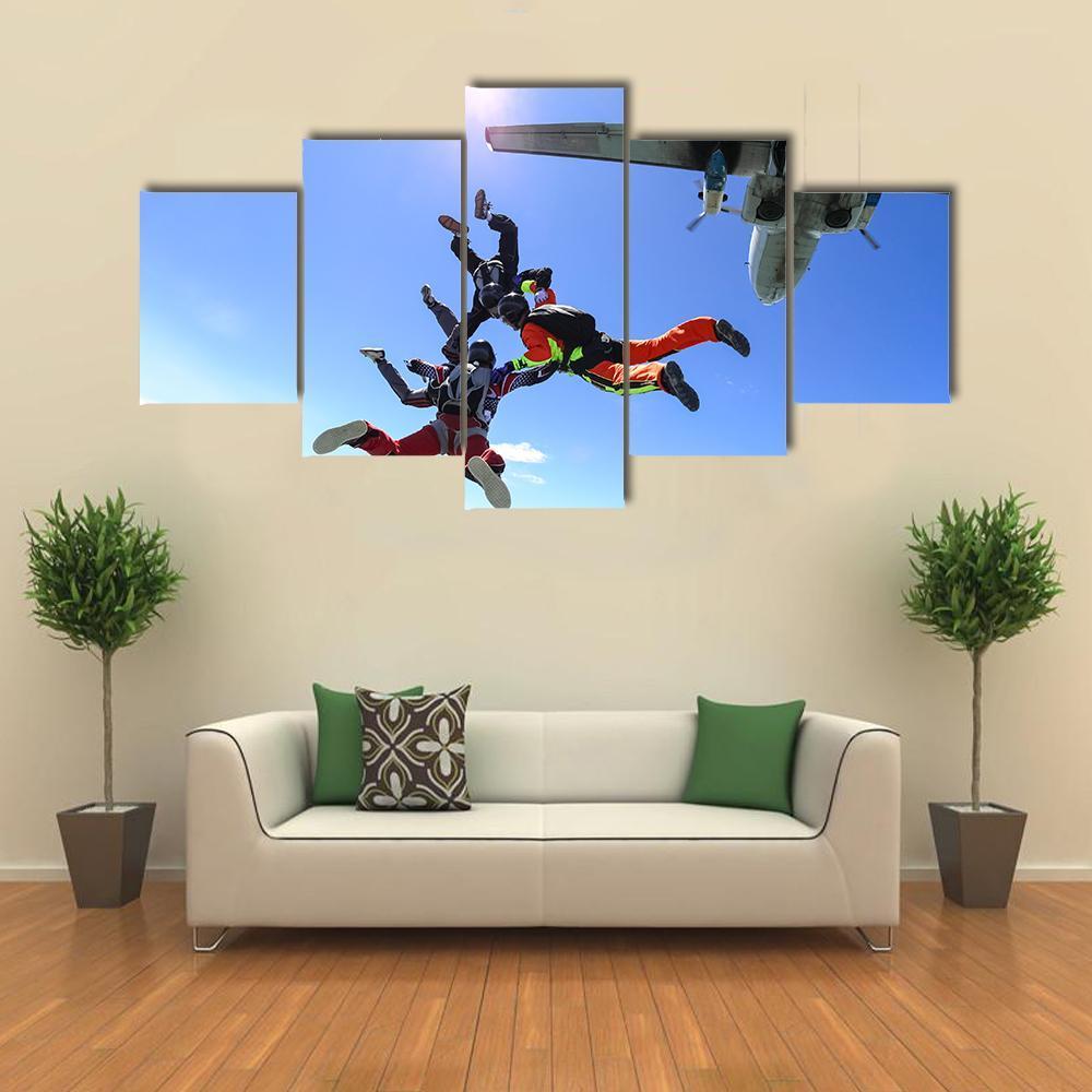Four Parachutists Jumping Canvas Wall Art-5 Star-Gallery Wrap-62" x 32"-Tiaracle