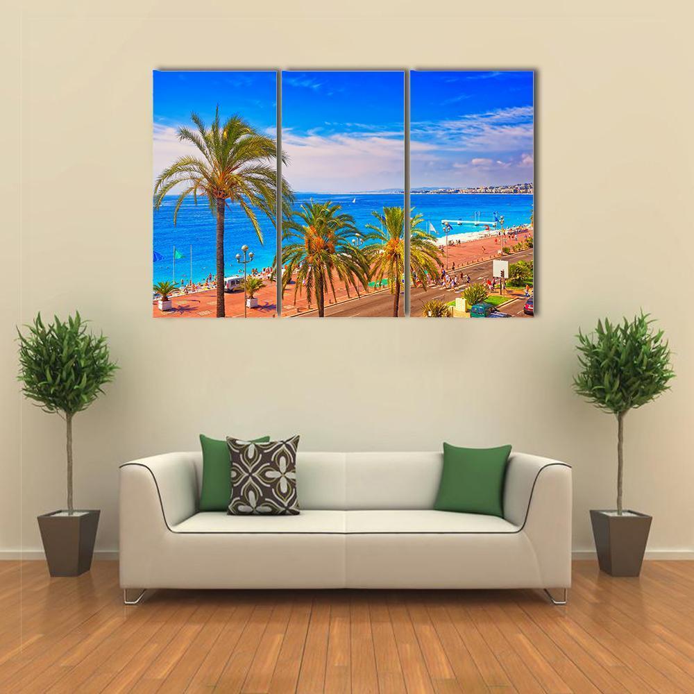 Summer Beach in France Canvas Wall Art in orange, green and blue, 3 panel horizontal set hung on a wall