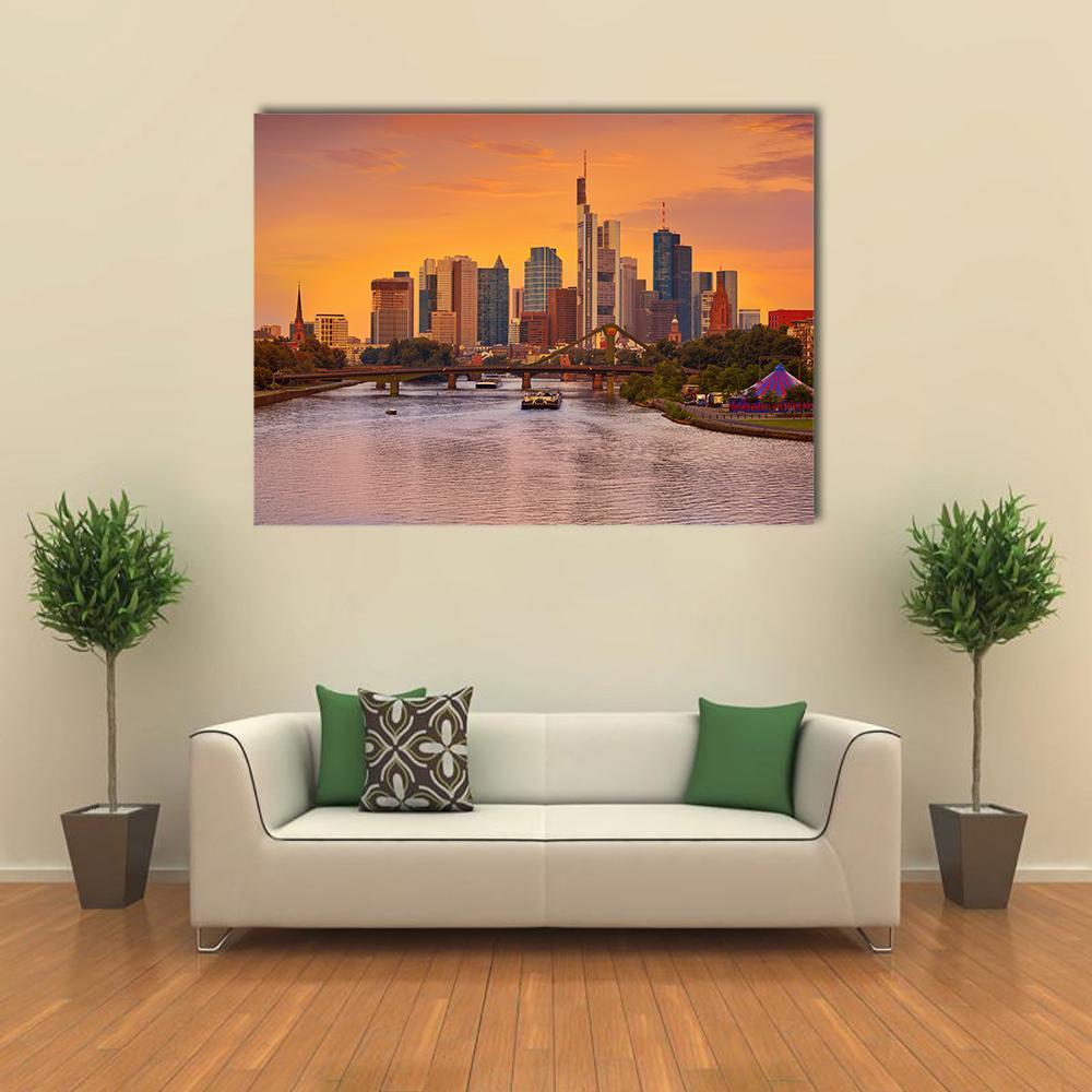 Frankfurt Skyline with Meno River Canvas Wall Art in orange, yellow and blue, single panel hung on a wall