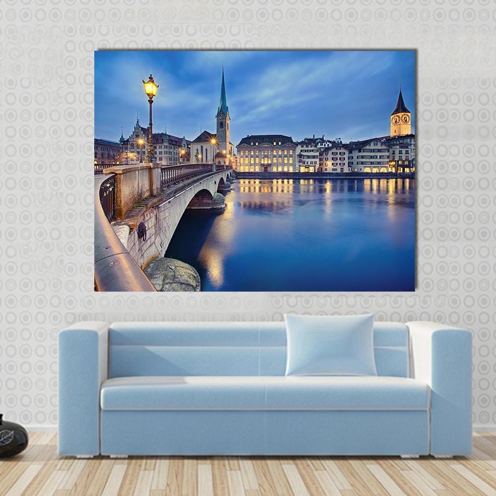 Fraumunster Church at Night Canvas Wall Art in gold, yellow and blue, single panel hung on a wall