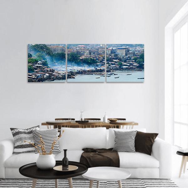 Coastal Hillside Cityscape with Harbor Boats Panoramic Canvas Wall Art in brown, green and blue, hung on a wall