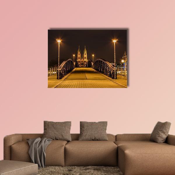 Freiburg Night Bridge and Church Spires Canvas Wall Art in black, gold and yellow, single panel hung on a wall