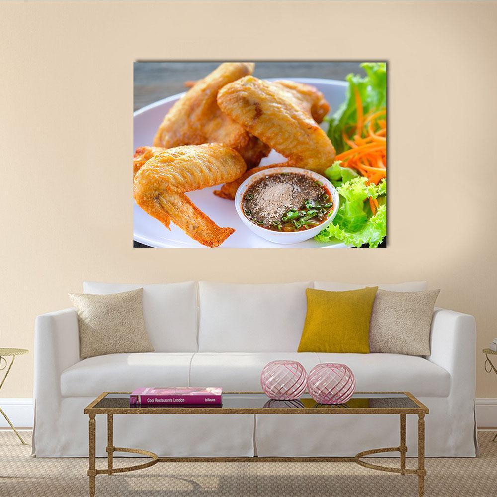 Crispy Fried Chicken Wings with Dipping Sauce Canvas Wall Art in white, brown and yellow, single panel hung on a wall