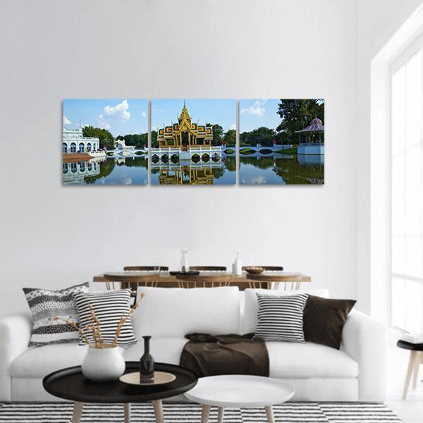 Bang Pa-in Palace Pavilion Reflection Panoramic Canvas Wall Art in gold, green and blue, hung on a wall
