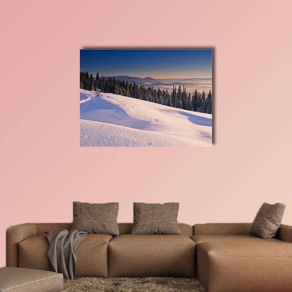 Sunlit Snowy Mountain Landscape Canvas Wall Art in white, orange and blue, single panel hung on a wall