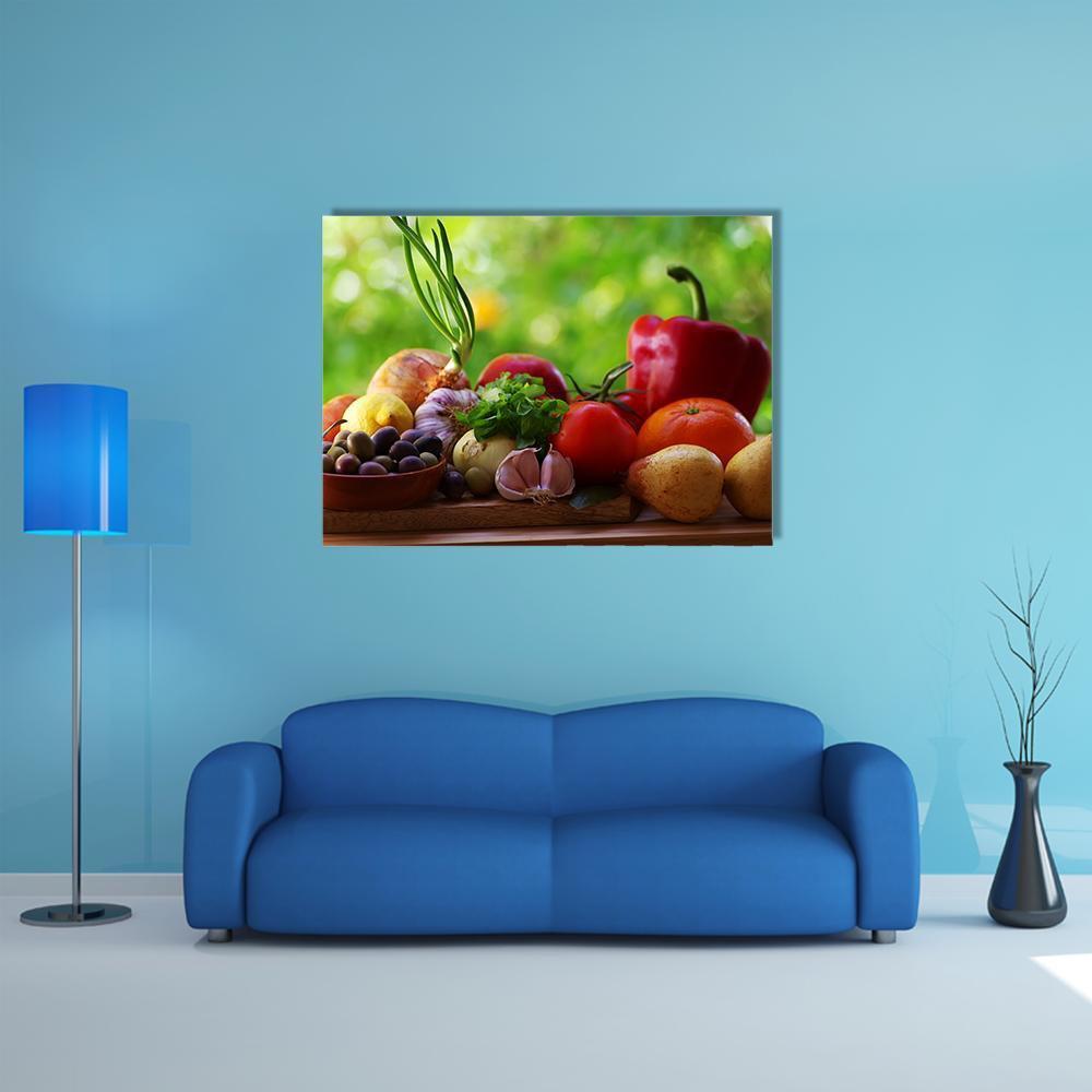 Fruits and Vegetables Still Life Canvas Wall Art in red, orange and green, single panel hung on a wall