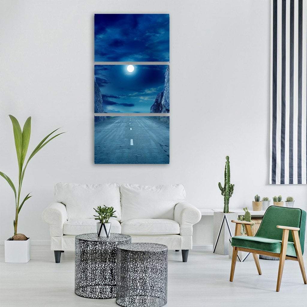 Road to the Moon Vertical Canvas Wall Art in white, blue and navy, hung on a wall