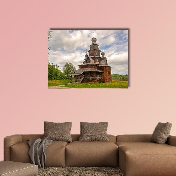 Wooden Church with Onion Domes Canvas Wall Art in brown, green and blue, single panel hung on a wall
