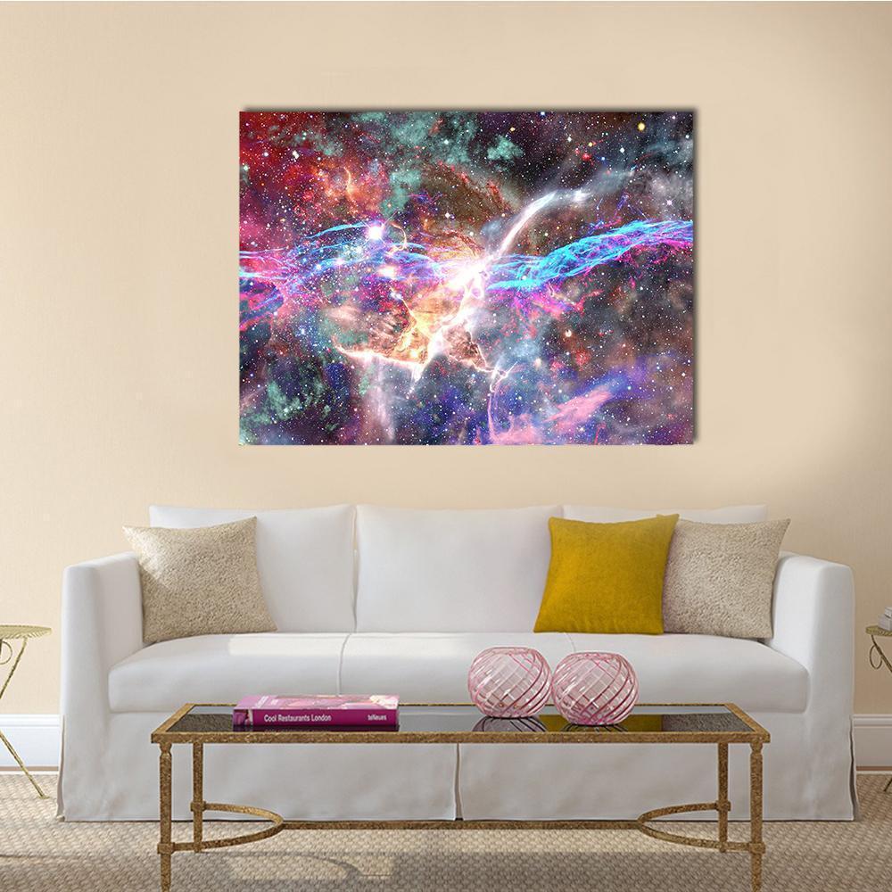Vibrant Galaxy and Nebula Canvas Wall Art in blue, purple and multicolor, single panel hung on a wall