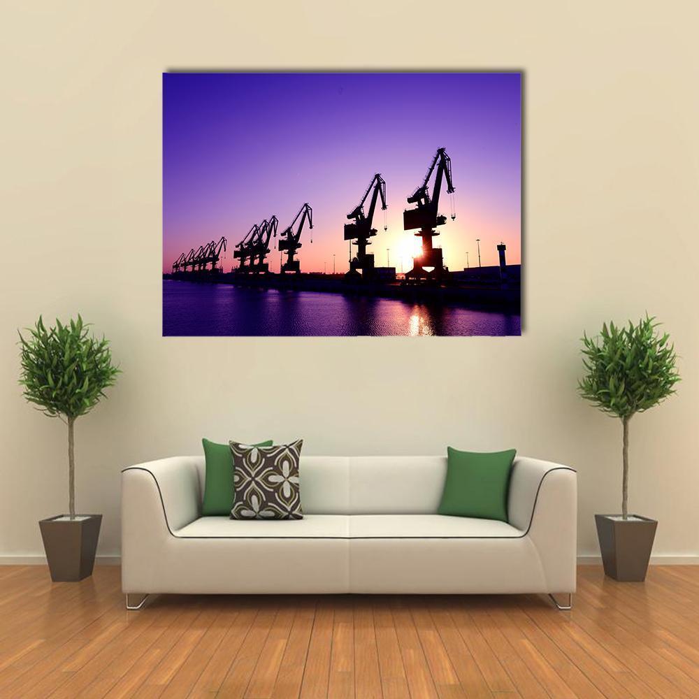 Gantry Crane at Sunset Canvas Wall Art in black, orange and purple, single panel hung on a wall
