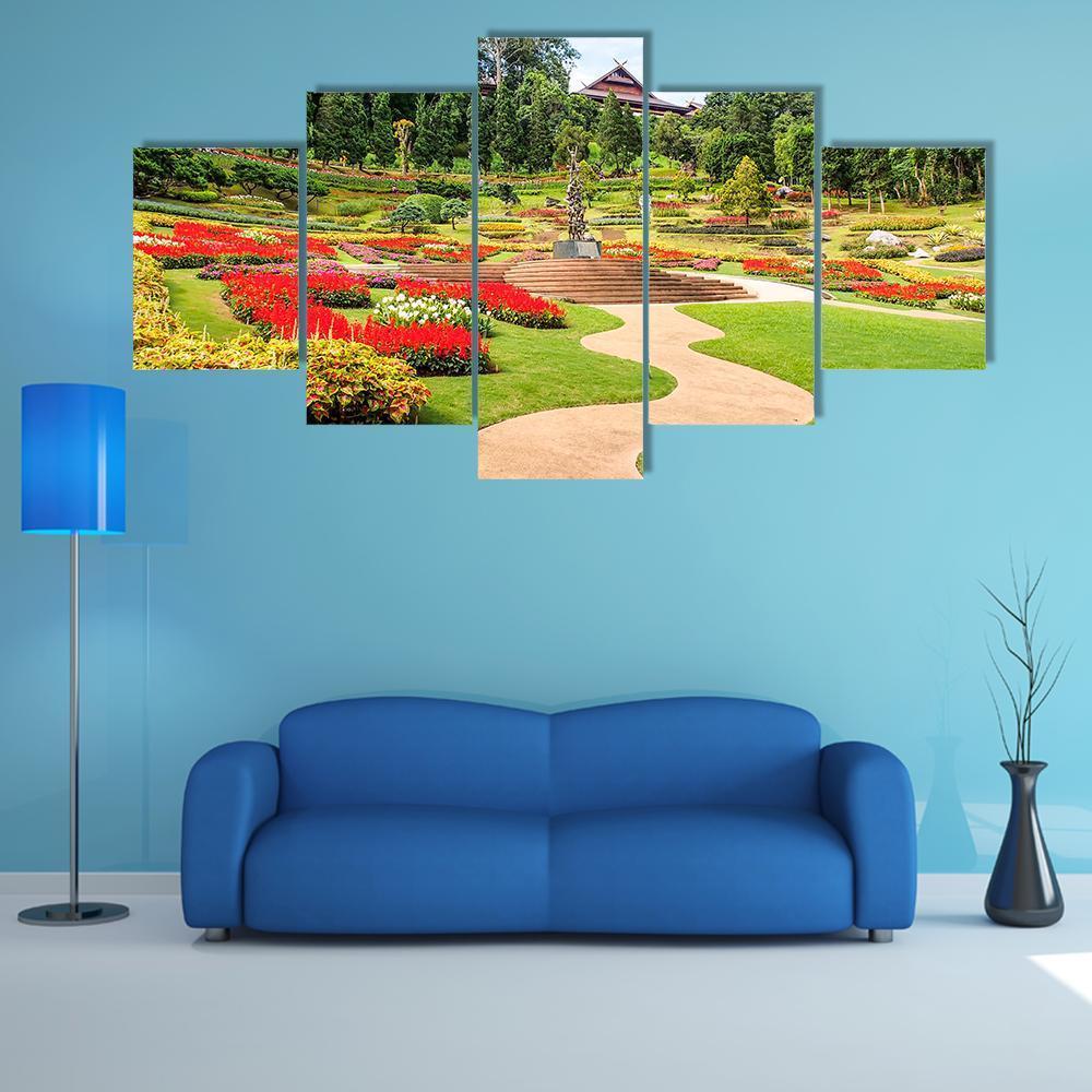 North Thailand Garden Canvas Wall Art in red, green and multicolor, 5 panel Star layout hung on a wall