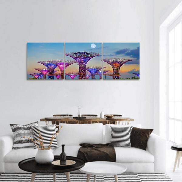 Gardens by the Bay Panoramic Canvas Wall Art in blue, purple and pink, hung on a wall