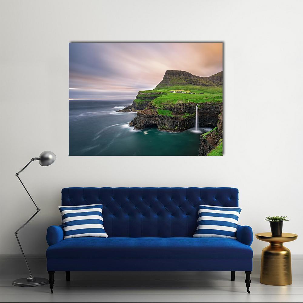 Gasadalur Village Waterfall Canvas Wall Art in gray, green and blue, single panel hung on a wall