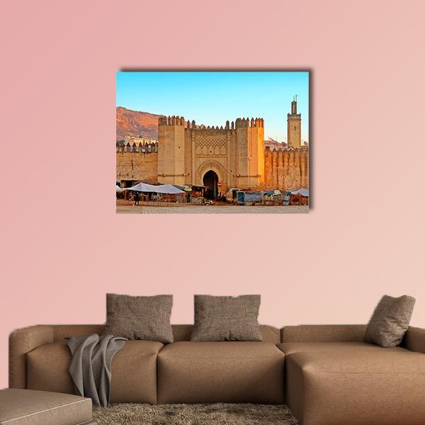 Gate to the Ancient Medina of Fez Canvas Wall Art in beige, brown and blue, single panel hung on a wall