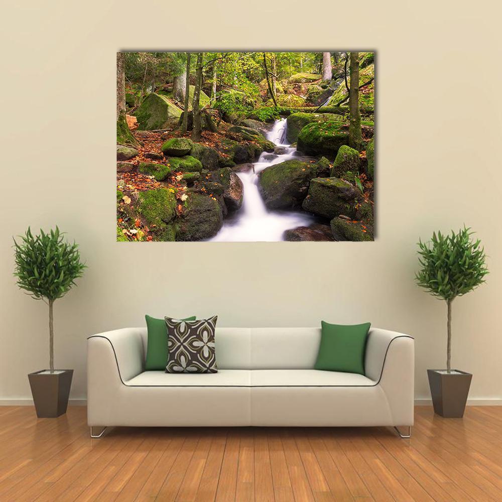 Gertelsbacher Waterfall Canvas Wall Art in white, brown and green, single panel hung on a wall