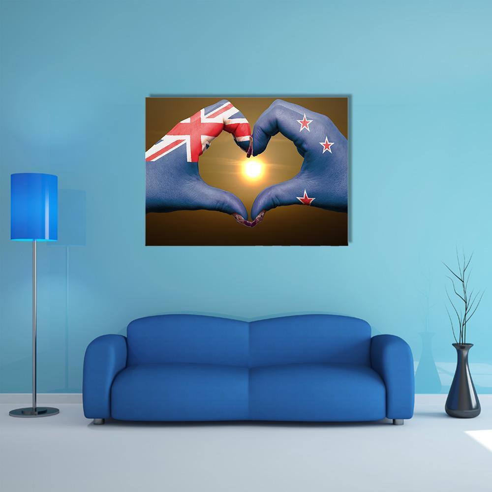 Hands Forming Heart with New Zealand Flag Canvas Wall Art in brown, red and blue, single panel hung on a wall