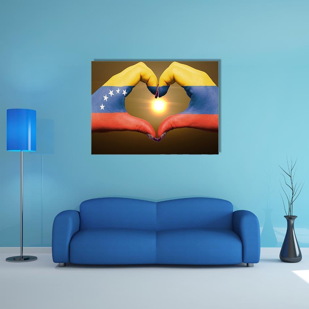 Hands Painted with Venezuelan Flag Canvas Wall Art in red, yellow and blue, single panel hung on a wall
