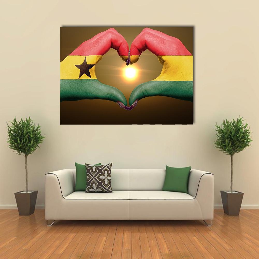 Hands Forming Ghana Flag Heart Canvas Wall Art in red, yellow and green, single panel hung on a wall