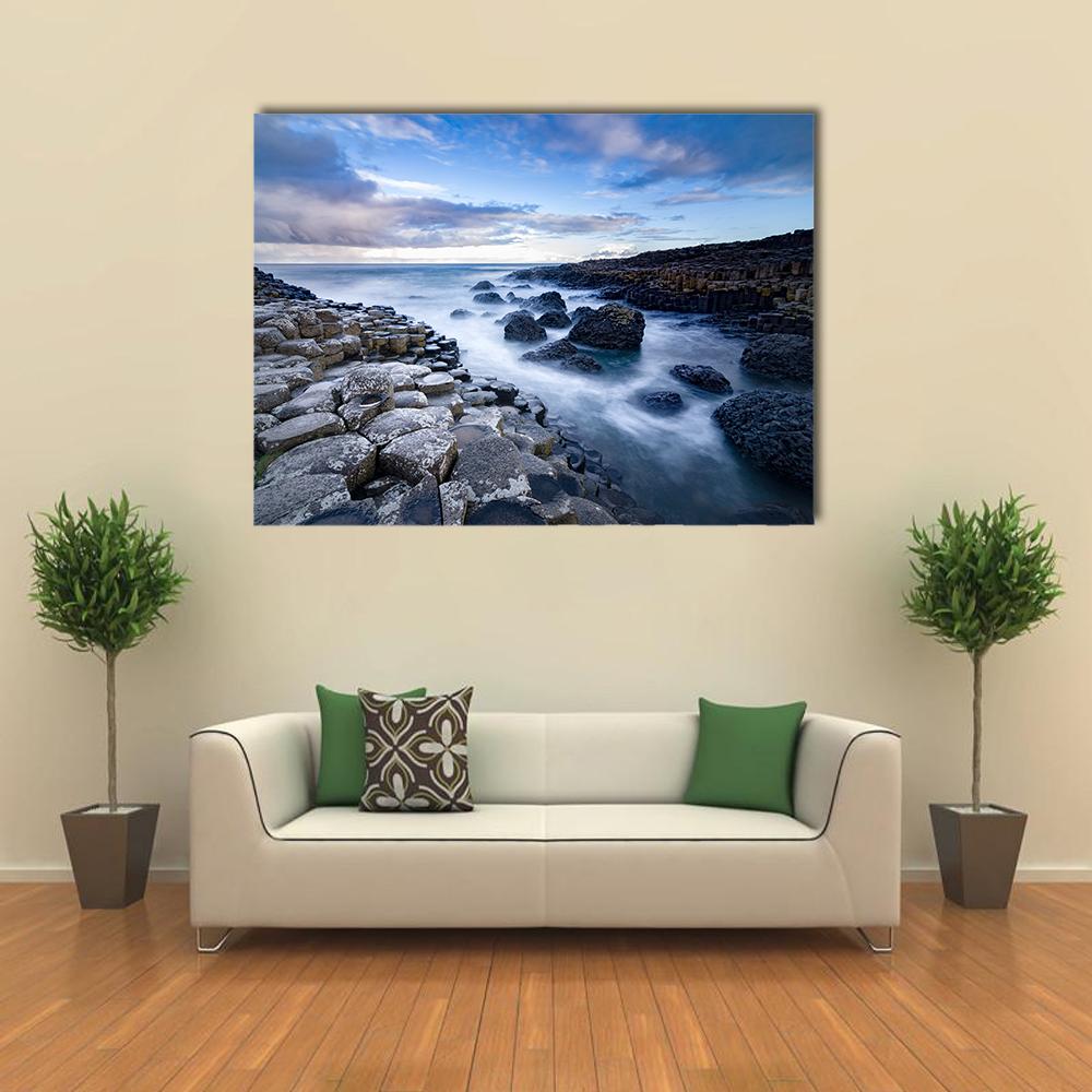 Giant's Causeway Basalt Columns, Ireland Canvas Wall Art in black, gray and blue, single panel hung on a wall