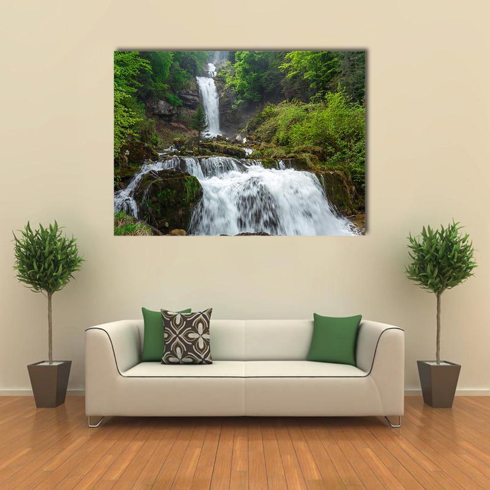 Giessbach Waterfall Canvas Wall Art in white, gray and green, single panel hung on a wall