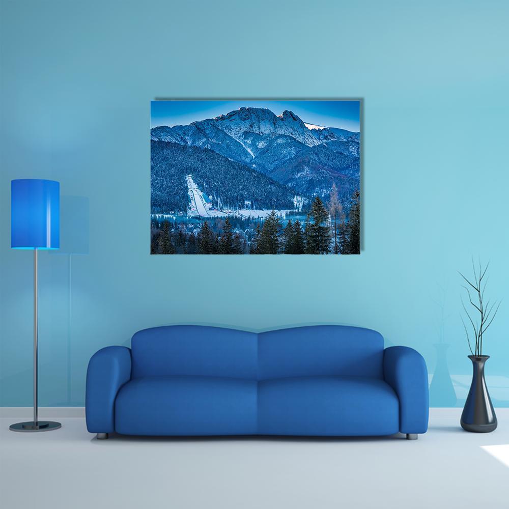 Giewont Peak in Winter Canvas Wall Art in white and blue, single panel hung on a wall