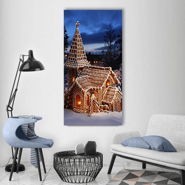 Gingerbread Church on a Starry Christmas Night Vertical Canvas Wall Art in white, brown and blue, single vertical panel hung on a wall