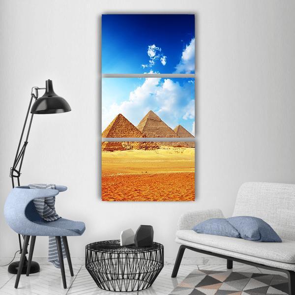 Great Pyramids of Giza Vertical Canvas Wall Art in gold, yellow and blue, hung on a wall