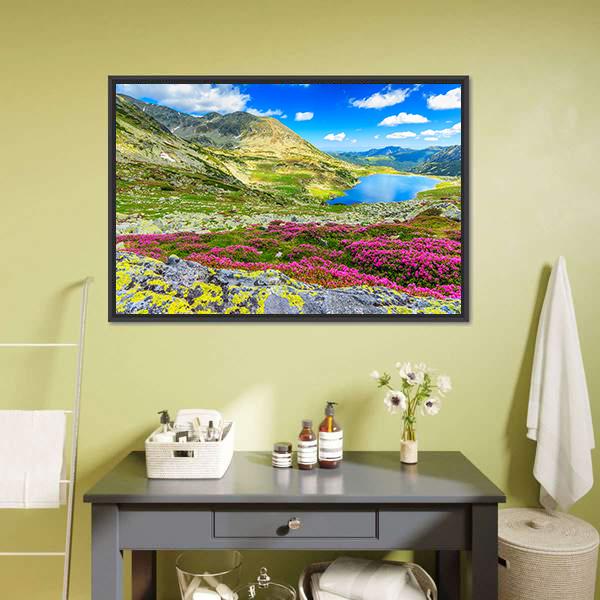 Glacier Lake with Wildflowers Canvas Wall Art in green, blue and pink, framed canvas, product view on a white background