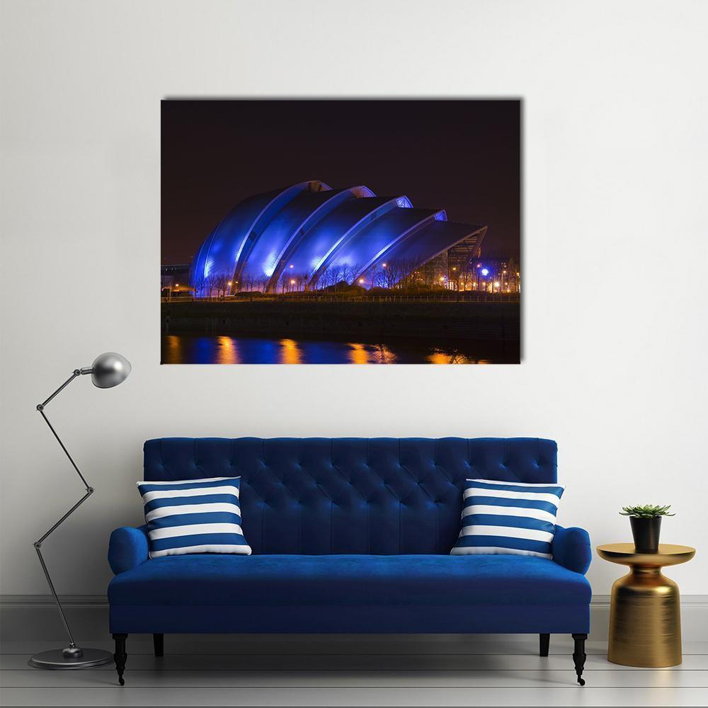 Glasgow Armadillo Building Canvas Wall Art in black and blue, single panel hung on a wall
