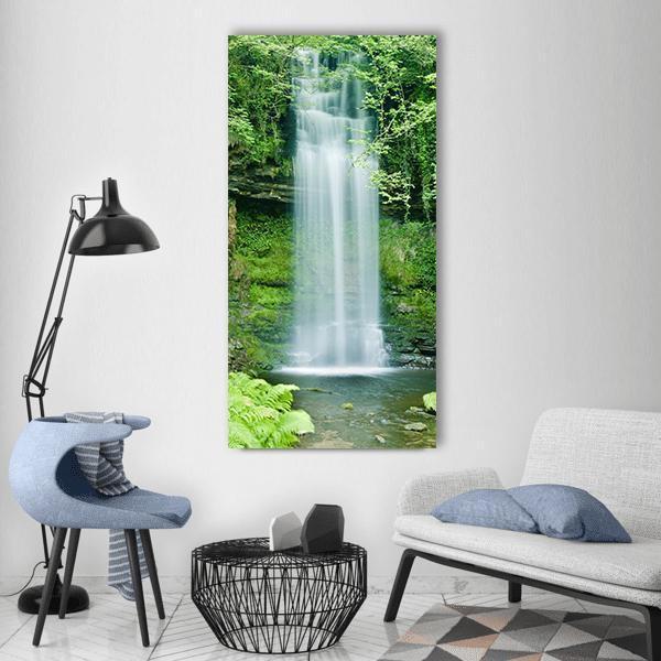 Glencar Waterfall Ireland Vertical Canvas Wall Art in white, gray and green, single vertical panel hung on a wall