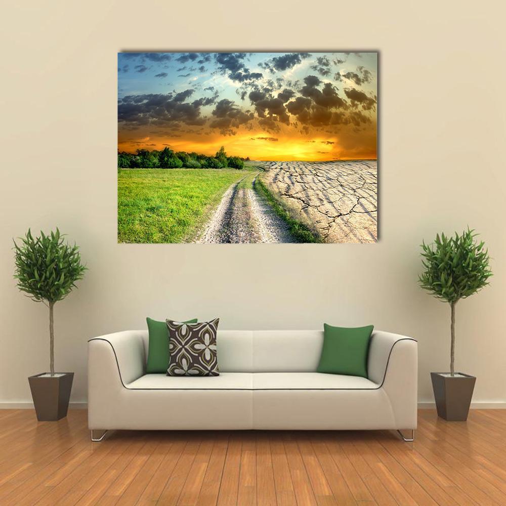 Global Warming Landscape with Sunset Canvas Wall Art in orange, green and blue, single panel hung on a wall